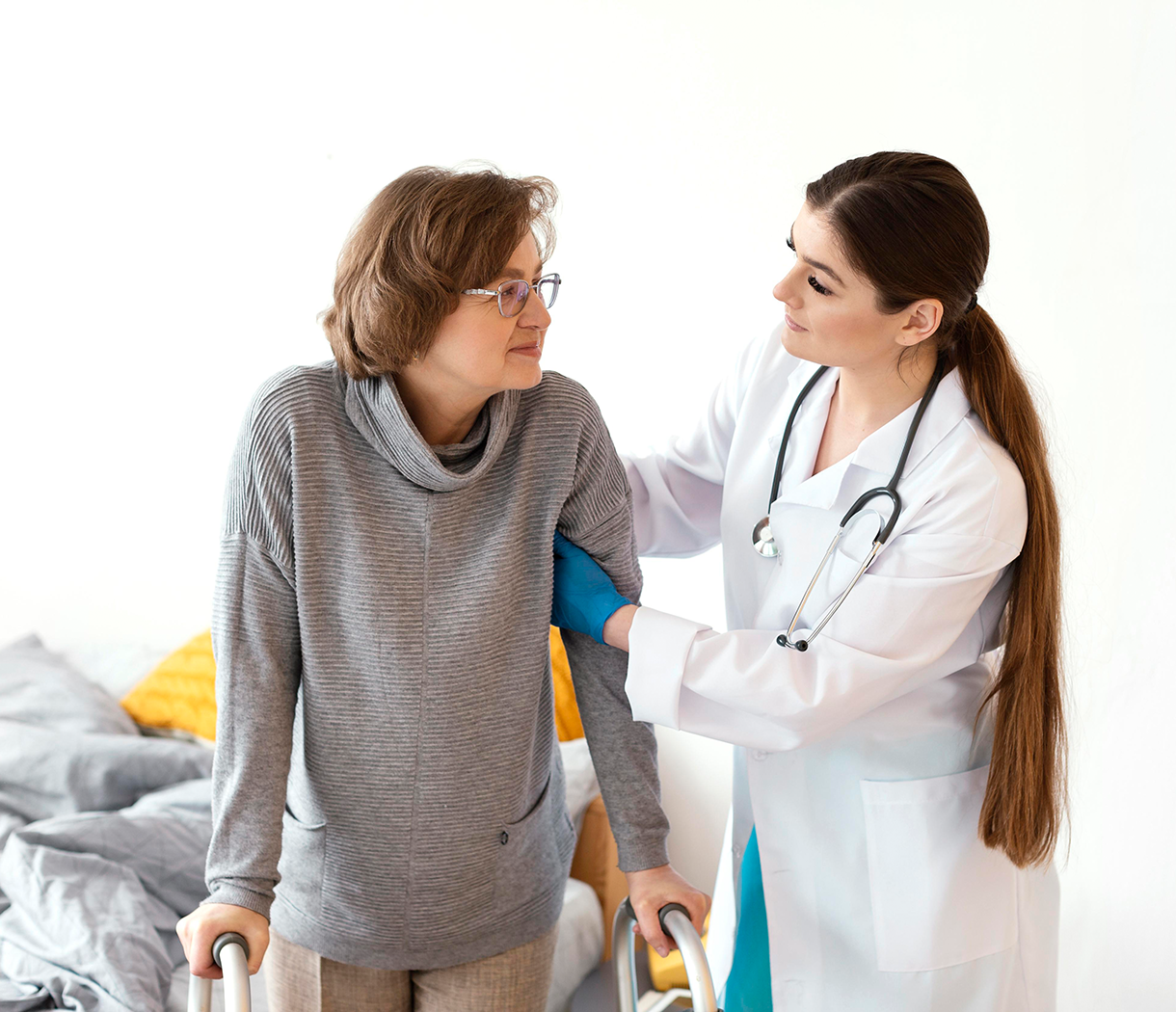 A doctor assisting a patient during modern rehabilitation therapy in a professional rehabilitation center